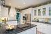 Beautiful white cabinets with dark stone counters