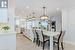 Stunning Kitchen Equipped with High-Gloss White Cabinetry