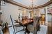 Dining Room with a Coffered Ceiling and Hardwood Floor