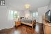 Second Bedroom with Hardwood Flooring