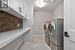 Upper Level Laundry Room with an Abundance of Custom Cabinetry