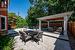 The Outdoor Haven Includes a Sprawling Natural Stone Patio and a 13'7 x 16' Pavilion