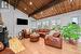 Living Room with Woodburning Fireplace and Exposed Wood Vaulting Ceiling