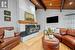 Living Room with Woodburning Fireplace and Exposed Wood Vaulting Ceiling