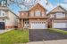 Front of property featuring a garage and a front lawn