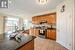 Kitchen featuring sink, tasteful backsplash, dark stone countertops, stainless steel electric stove, and light tile patterned floors