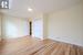 Unfurnished bedroom with a closet, light hardwood / wood-style flooring, and a skylight