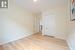 Unfurnished bedroom featuring a closet and light wood-type flooring