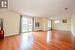 Empty room with a healthy amount of sunlight and light hardwood / wood-style floors