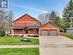 View of front of home featuring a garage and a front yard