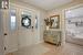 Foyer entrance with light parquet flooring