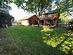 View of yard featuring a shed and a wooden deck