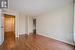 Spare room with a textured ceiling and light hardwood / wood-style floors