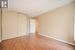 Unfurnished bedroom with a closet, light hardwood / wood-style flooring, and a textured ceiling