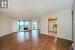 Unfurnished room featuring hardwood / wood-style flooring and a textured ceiling