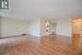 Unfurnished room featuring a textured ceiling, light wood-type flooring, and baseboard heating