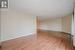 Unfurnished room featuring a textured ceiling and light wood-type flooring