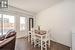 Dining area with dark hardwood / wood-style flooring