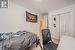 Carpeted bedroom featuring a closet