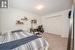 Bedroom featuring carpet floors and a closet