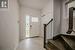 Entrance foyer with light tile patterned flooring