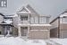 View of front of property featuring a double car garage