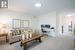 Family room featuring light carpet and large windows