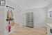 Kitchen with light countertops, stainless steel fridge, light wood-style flooring, and recessed lighting