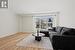 Living room featuring wood finished floors and baseboards