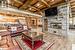 Entertainer's basement with natural stone wood burning fireplace