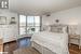 Bedroom featuring dark wood-type flooring