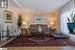 Living room with wood-style floors and crown molding