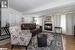 Family room with fireplace, closet and wood-type flooring