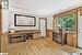 Sitting room with track lighting and light hardwood / wood-style flooring