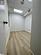 Unfurnished room featuring a paneled ceiling and light hardwood / wood-style flooring