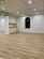 Unfurnished living room with light wood-type flooring and a paneled ceiling