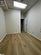 Empty room featuring a drop ceiling and light hardwood / wood-style floors