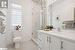 Bathroom featuring tile patterned flooring, vanity, toilet, and walk in shower