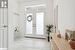 Doorway to outside featuring french doors and light tile patterned floors