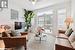 Living room featuring light hardwood / wood-style floors and ceiling fan