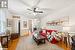 Living room featuring wood-type flooring and ceiling fan