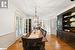 Dining space with light hardwood / wood-style floors and a notable chandelier