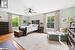 Bedroom featuring ceiling fan and light wood-type flooring