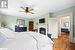 Bedroom featuring hardwood / wood-style floors and ceiling fan