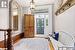 Foyer entrance featuring light hardwood / wood-style floors and french doors