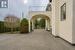 Ascending from the porte cochere, custom French doors open to a grand foyer.