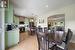 Tiled dining area featuring sink and ceiling fan