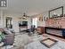 Spacious living room with barnwood inspired flooring.