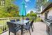 Rear deck surrounded by lush green space