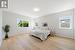 Huge primary bedroom with natural light